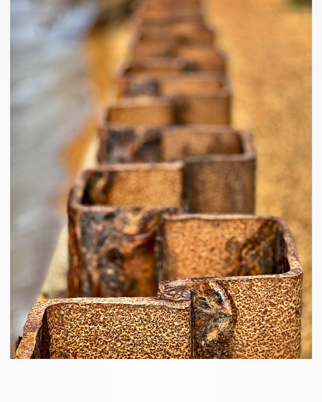 Detail of rusty sea wall in Bawdsey beach, Suffolk